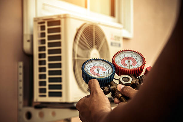 Professional Heat Pump Repair technician working in Hufsmith, TX